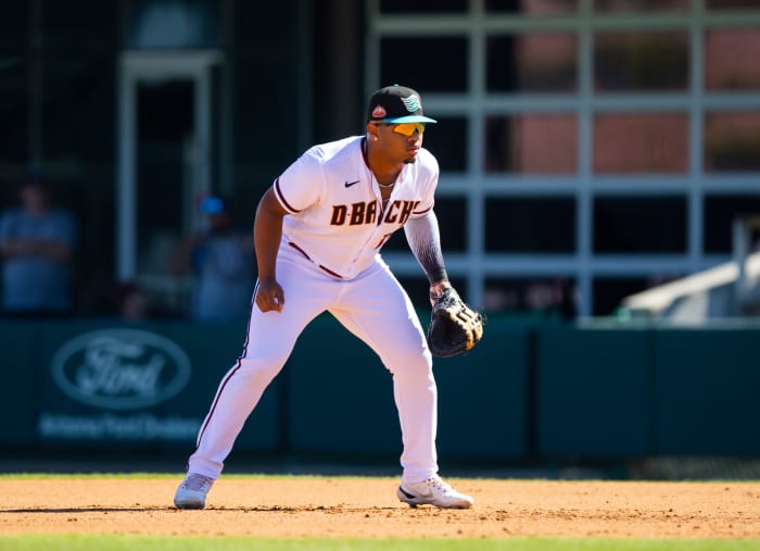 Oct 22, 2022; Phoenix, Arizona, USA; Arizona Diamondbacks first baseman Deyvison De Los Santos plays for the Salt River Rafters during an Arizona Fall League baseball game at Phoenix Municipal Stadium.